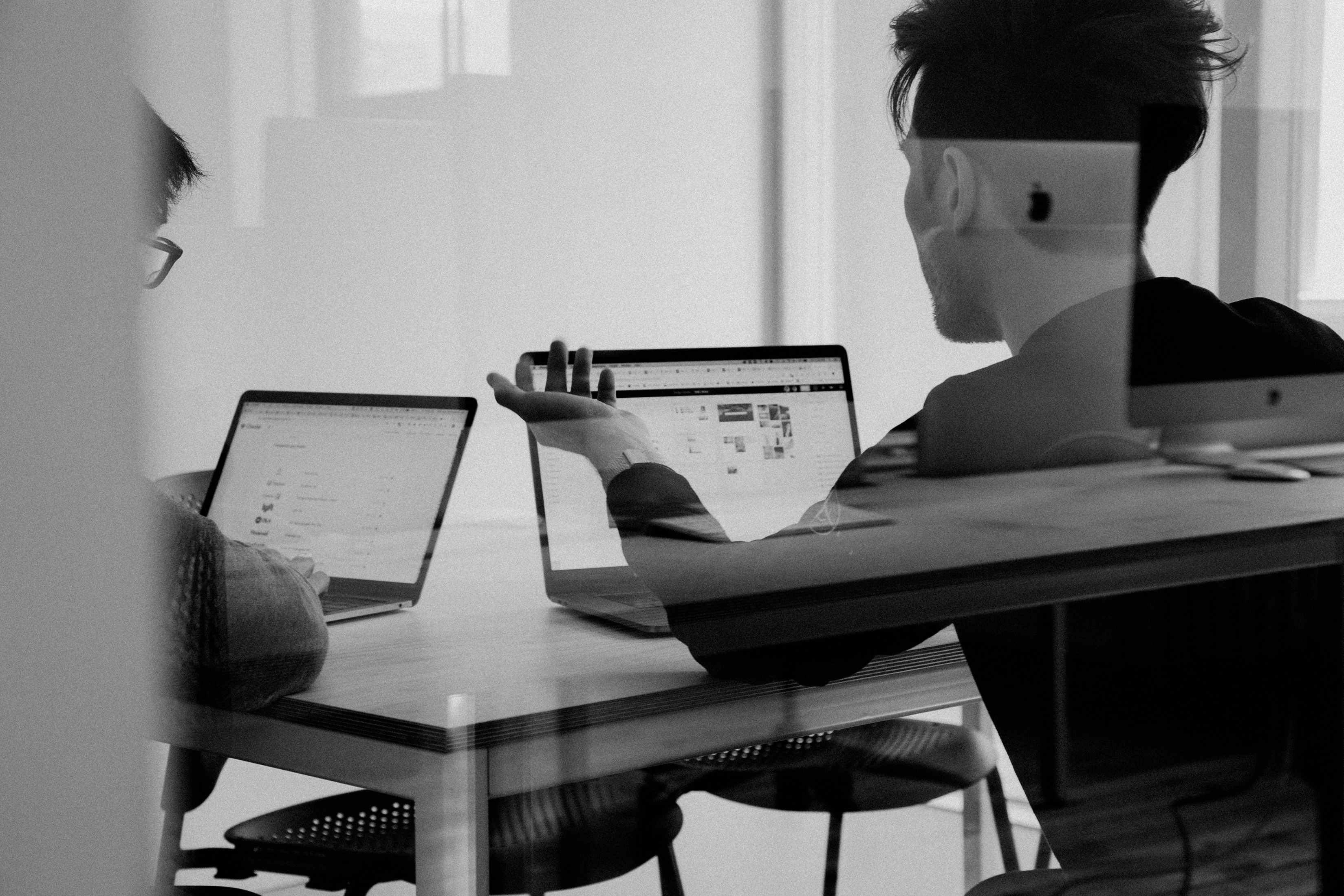 TwoMedia team member working at a laptop — founded 2019.